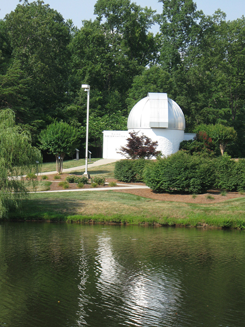 Cline Observatory with lake in foreground